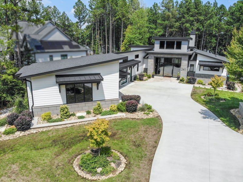 Elevated front view of 241 Cape August Place, with its landscaped lawn and curved driveway