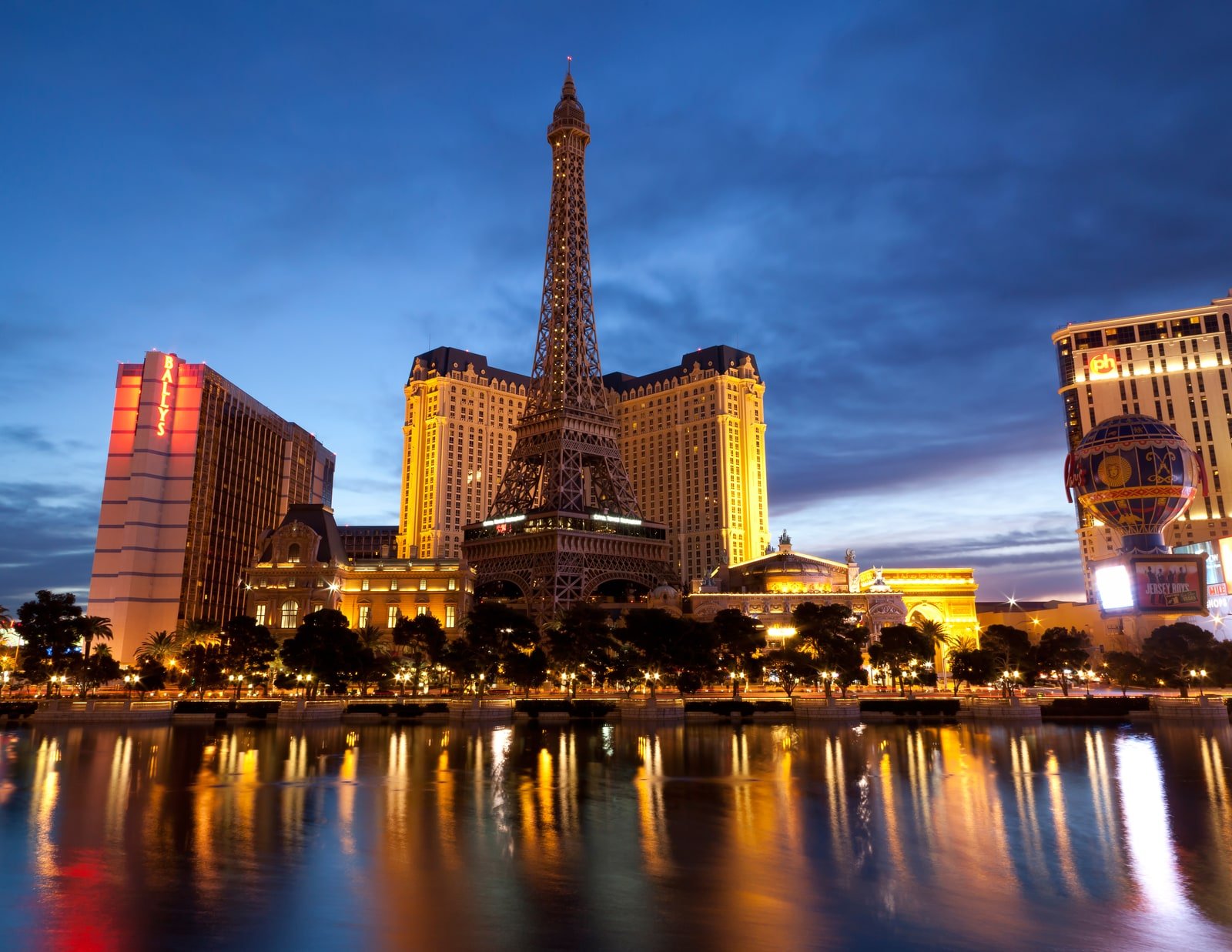 Paris Las Vegas and its illuminated Eiffel Tower replica at dusk